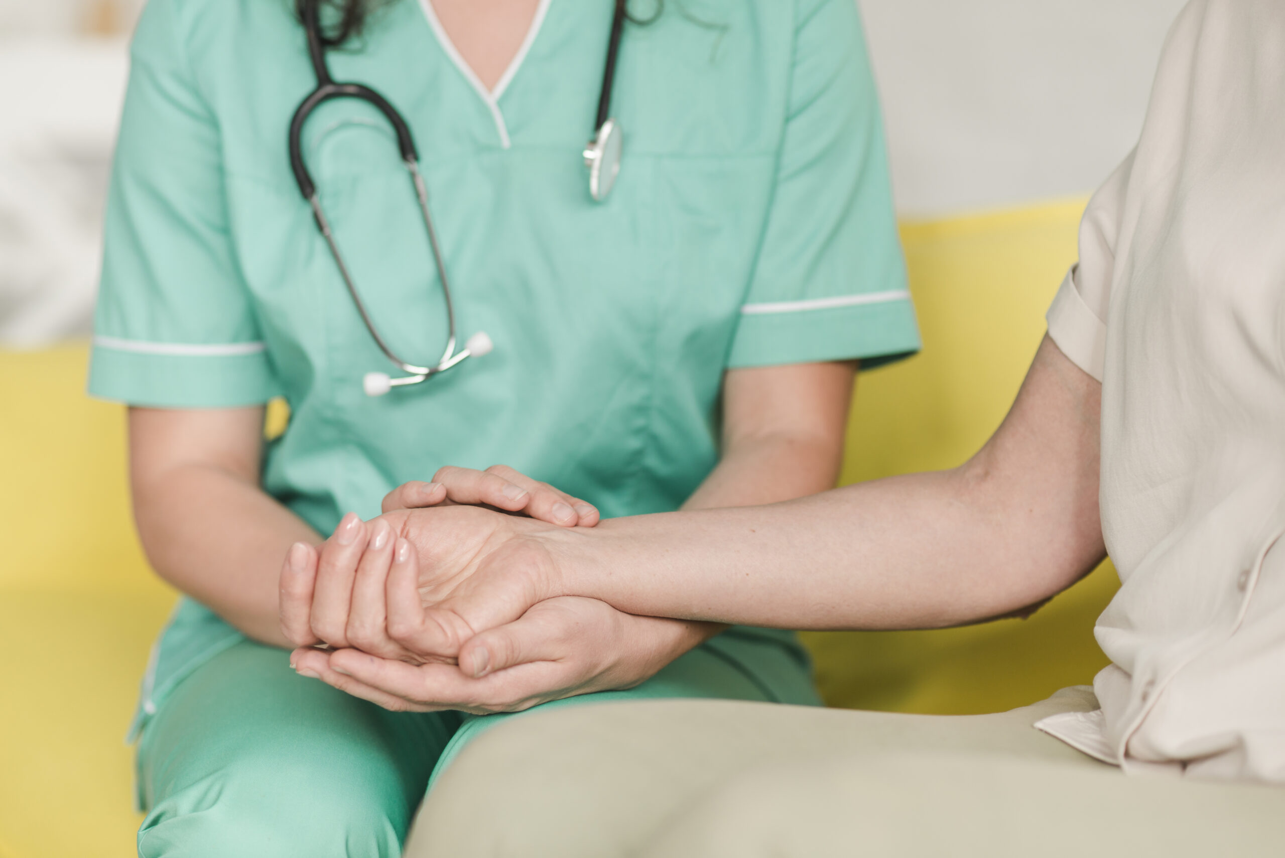 nurse-checking-pulse-female-patient-s-wrist